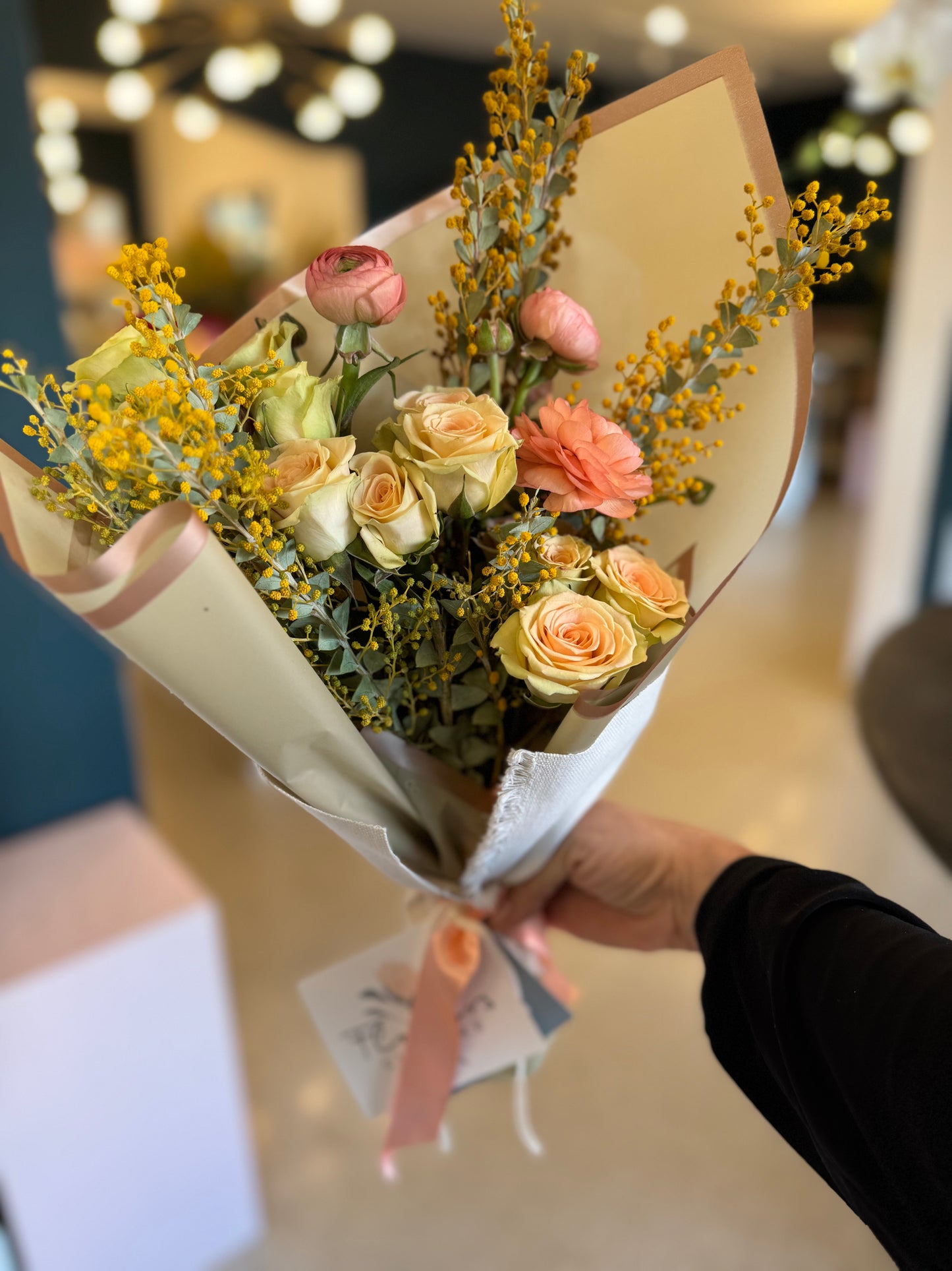 acacia mimosa, spray roses and ranunculus blush